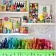 Colorful art supplies and decor on shelves in a craft room